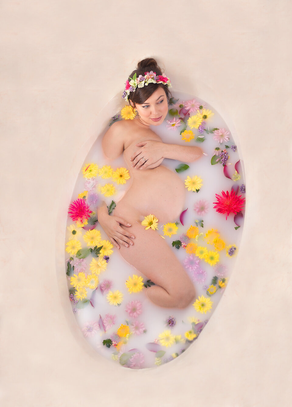Women laying in tub, pregnant during maternity photoshoot in Mount Juliet Tennessee photography studio