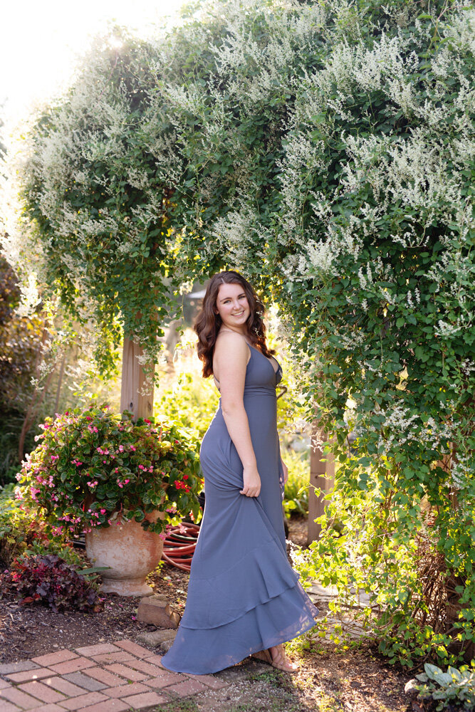 Senior session of young woman wearing a dress