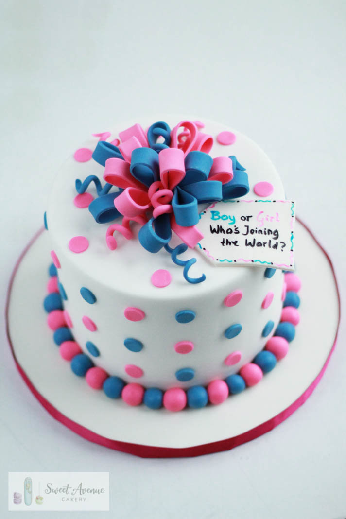 pink and blue present gender reveal cake