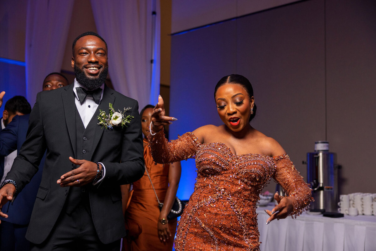 Tomi and Tolu Oruka Events Ziggy on the Lens photographer Wedding event planners Toronto planner African Nigerian Eyitayo Dada Dara Ayoola ottawa convention and event centre pocket flowers Navy blue groom suit ball gown black bride classy  189