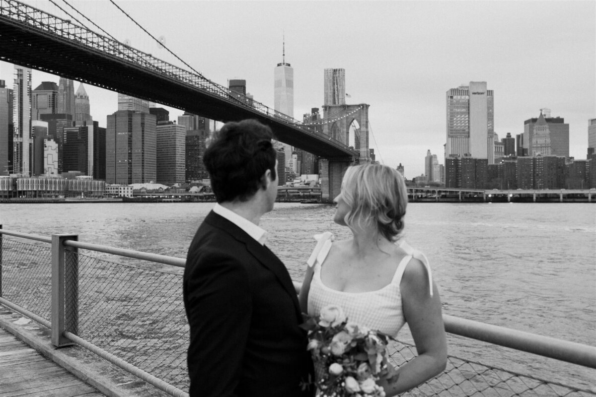 couple standing on bridge new york wedding photos