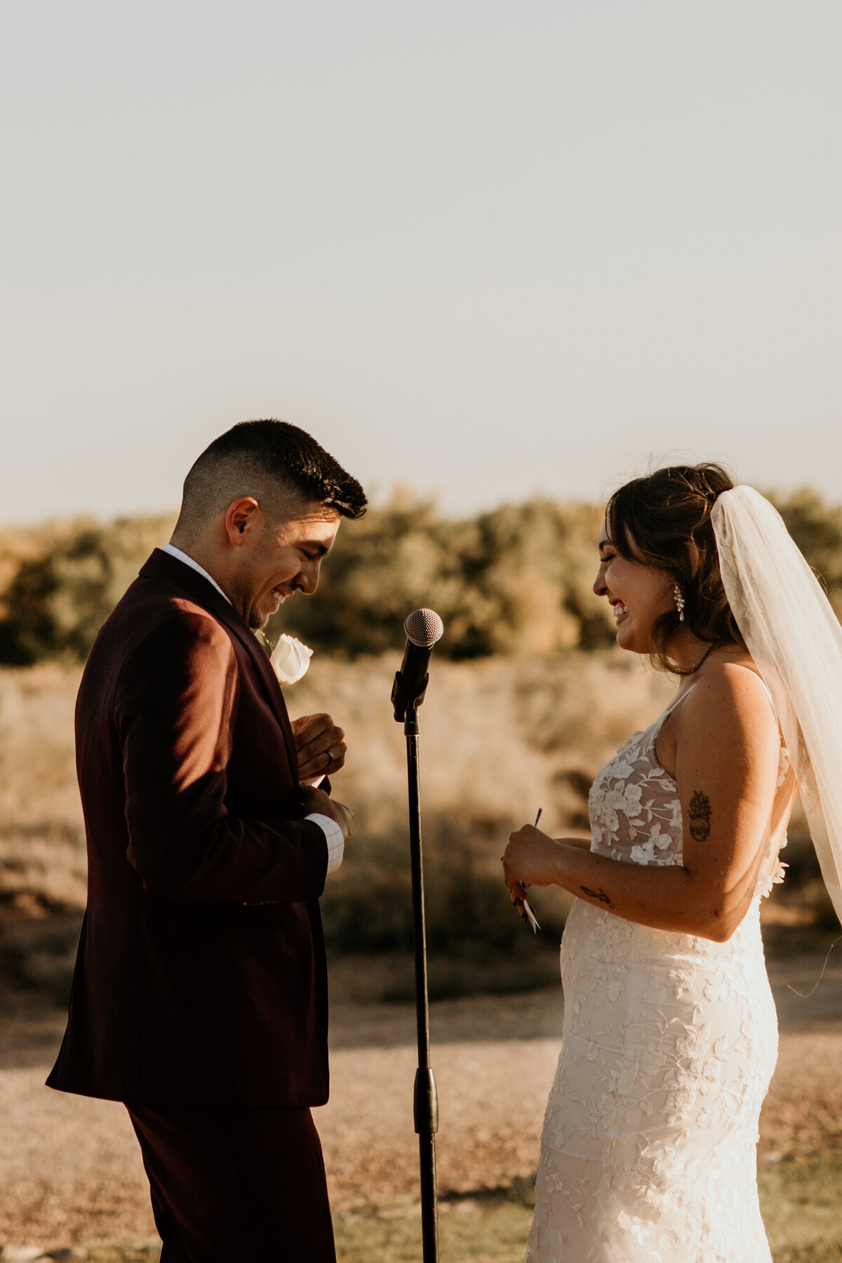 bride and groom reciting their vows in Albuquerque in front of the Sandia Mountains