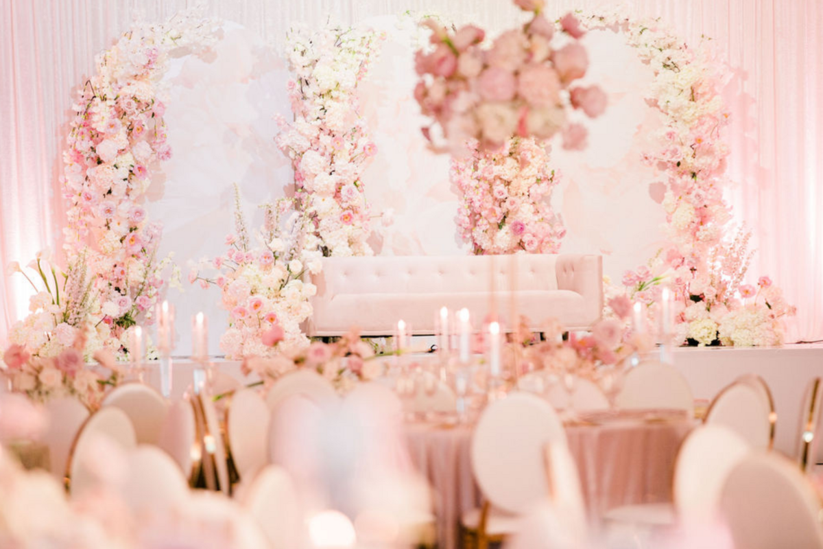 pink-gold-ivory-engagement-party-flower-backdrop-arch-sofa-candles