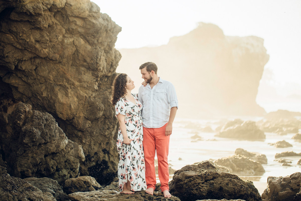 Engagement Photograph Of  Man And Woman Staring At Each Other In The Middle Of Rocks Los Angeles