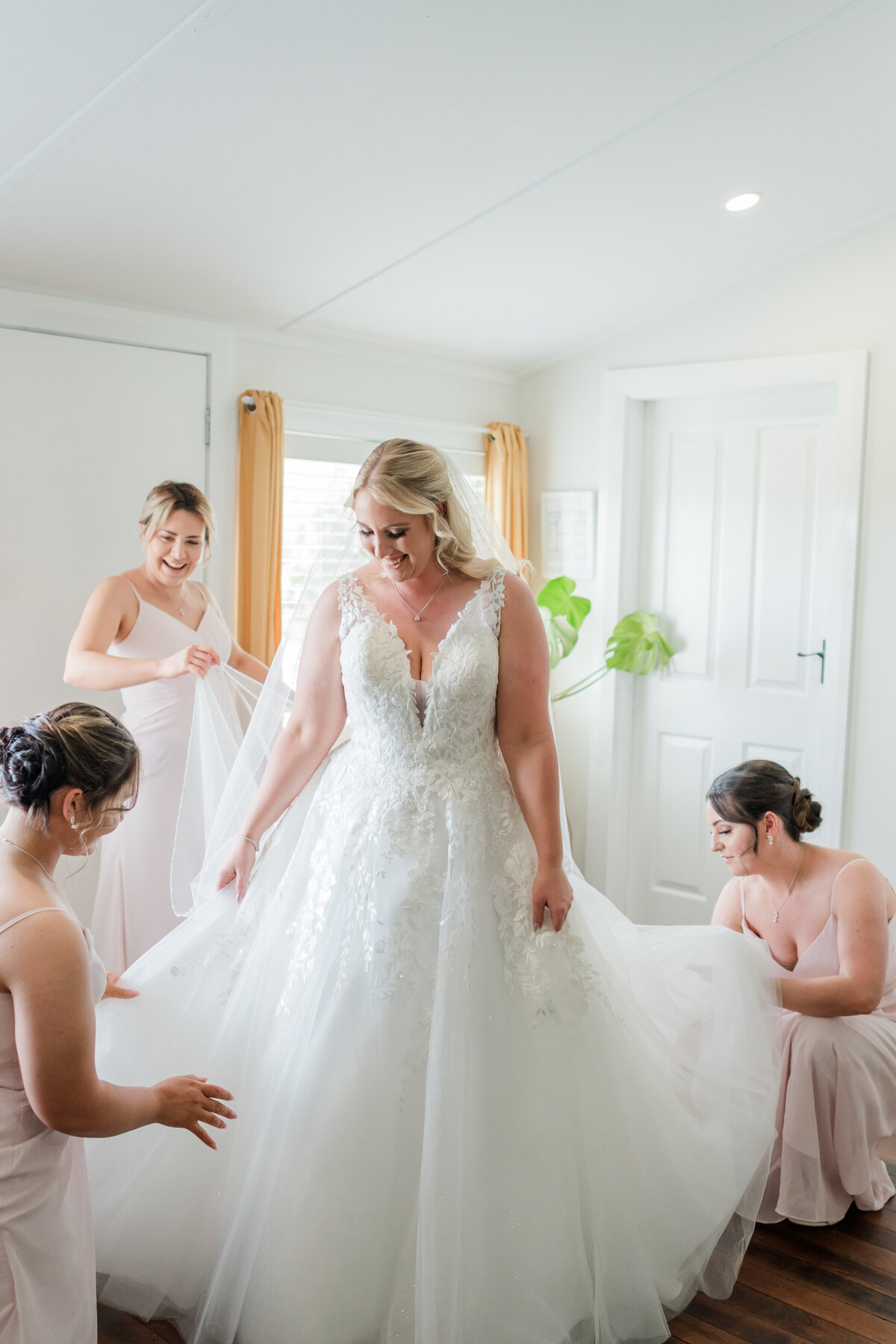 Bride and her bridesmaids getting ready