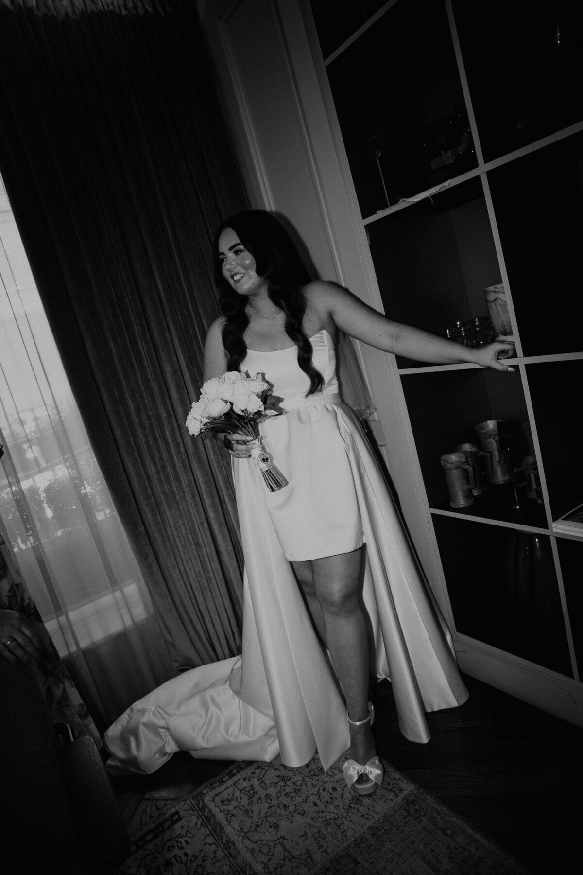 Bride waits for taxi to take her to her wedding ceremony at The Ole Marylebone Town Hall. 