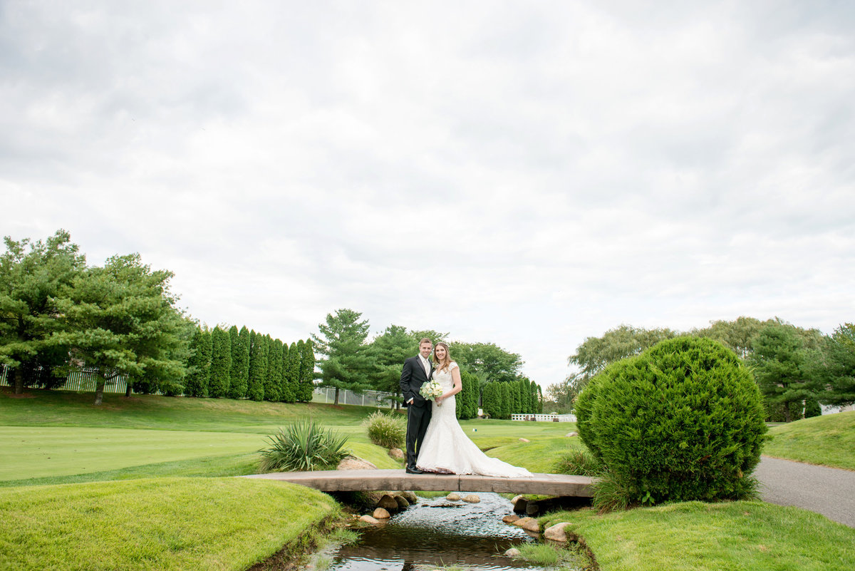 panoramic view of bride and groom on the golf course at Willow Creek Golf and Country Club