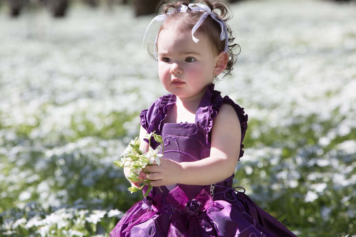 little girl in white flowers