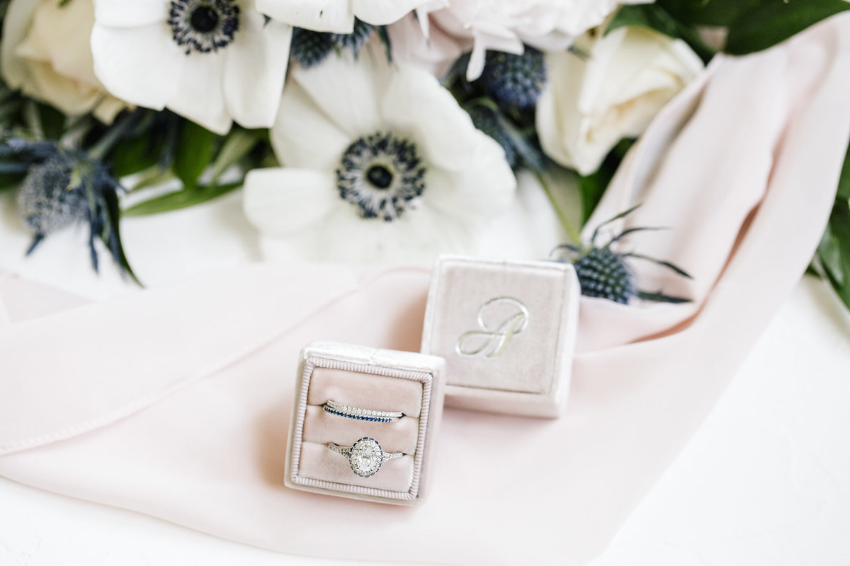 wedding rings on monogrammed box