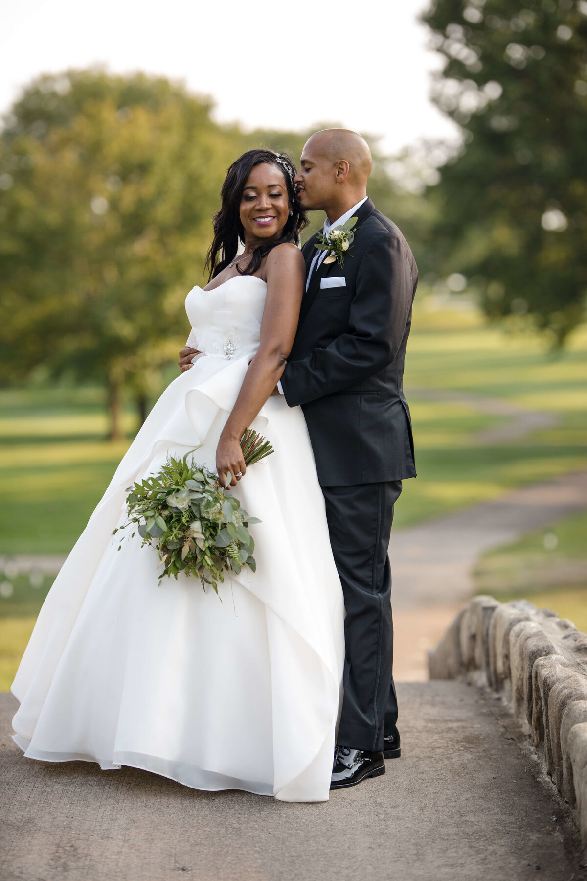 black bride and groom pose