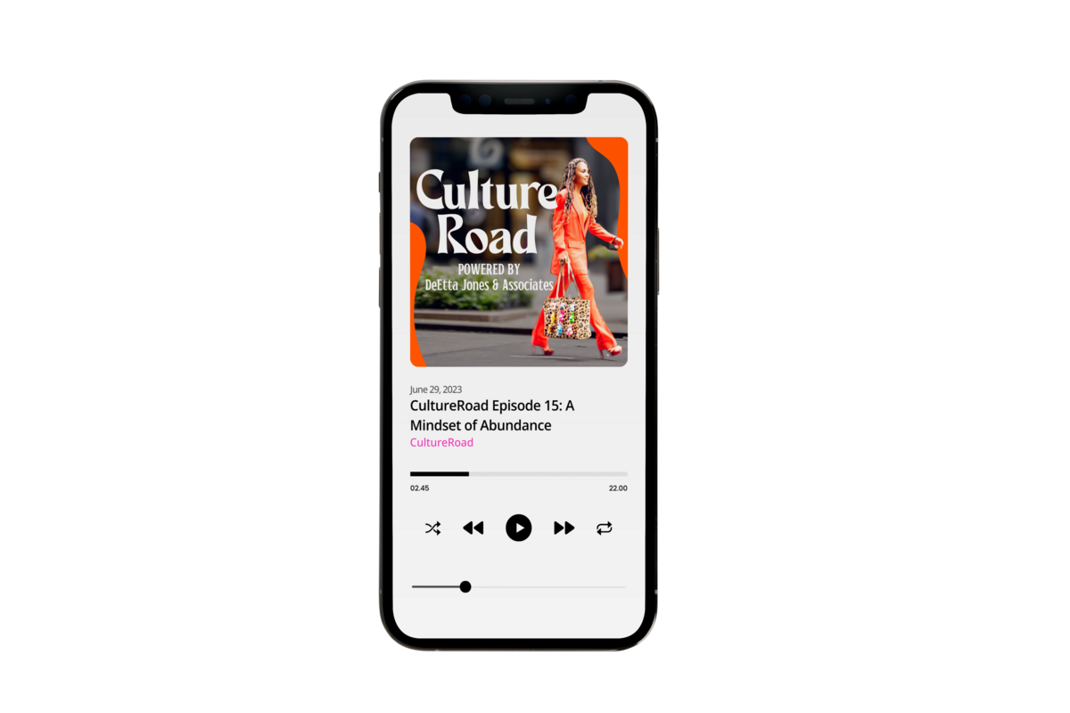 A picture of a phone which shows the cover photo of the CultureRoad podcast with CEO DeEtta Jones