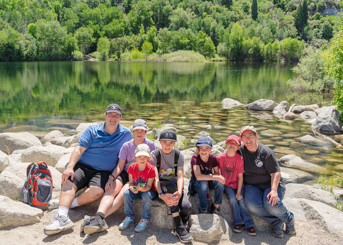 The woodruff family at the shore of Bell Canyon Reservoir in the summer