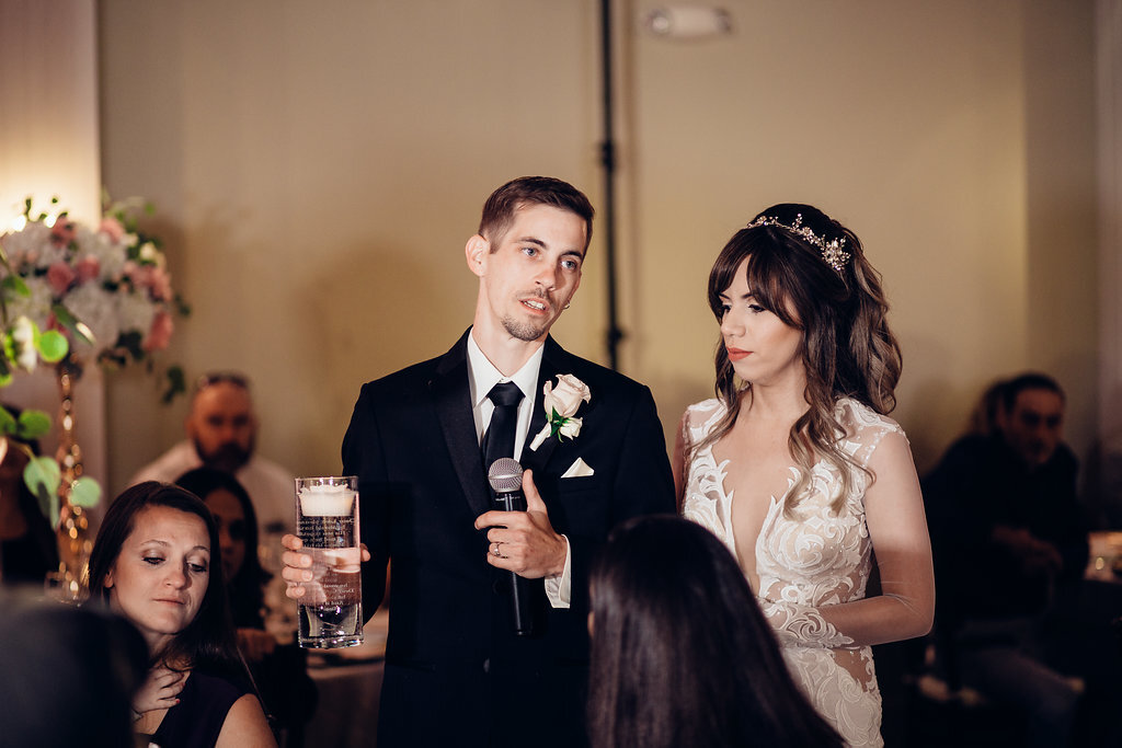 Wedding Photograph Of Groom Holding a Microphone Beside His Bride Los Angeles