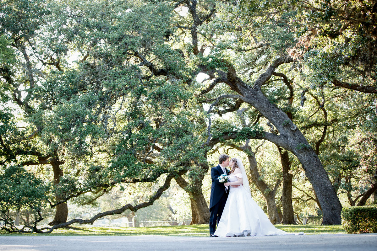Austin wedding photographer castle avalon wedding photographer bride groom trees