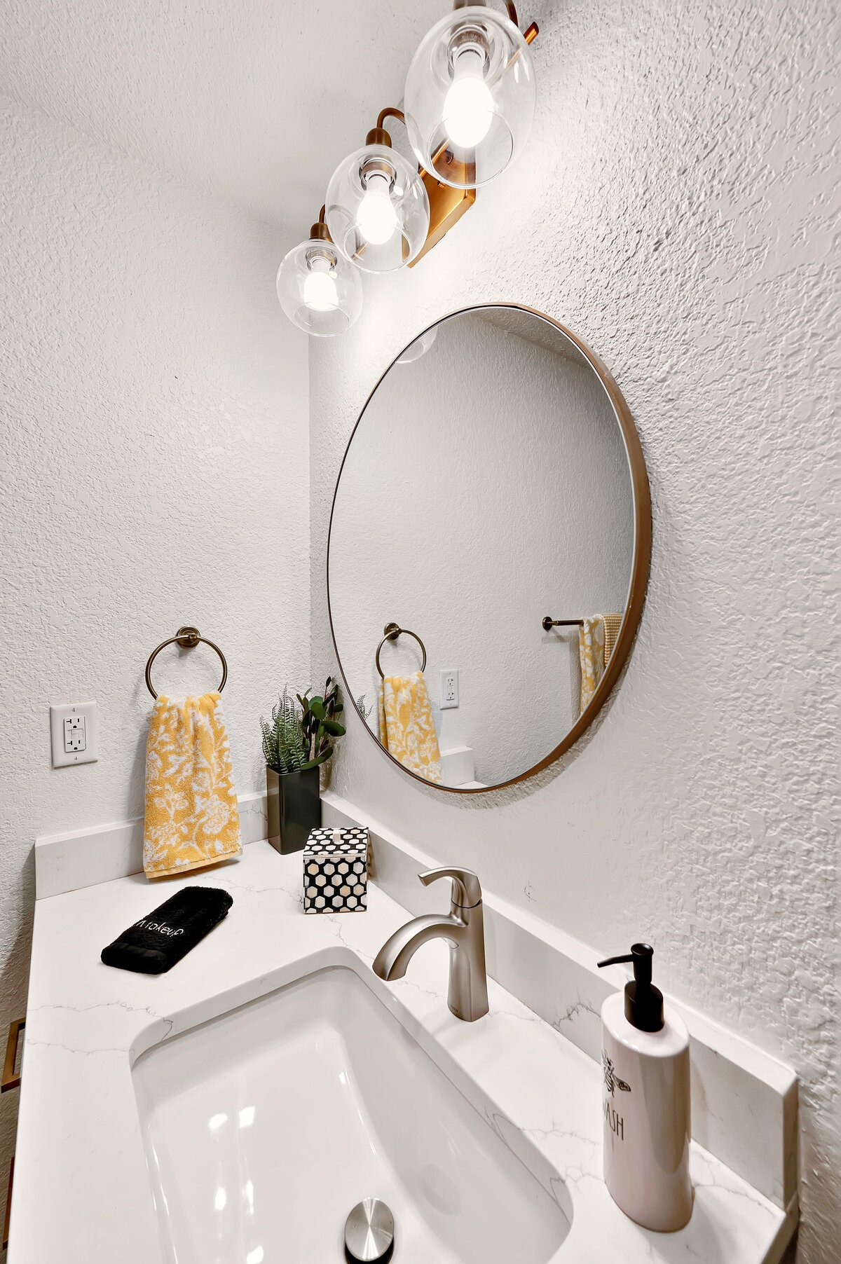 Beautiful bathroom vanity in this one-bedroom, one-bathroom vintage condo that sleeps 4 in the historic Behrens building in the heart of the Magnolia Silo District in downtown Waco, TX.