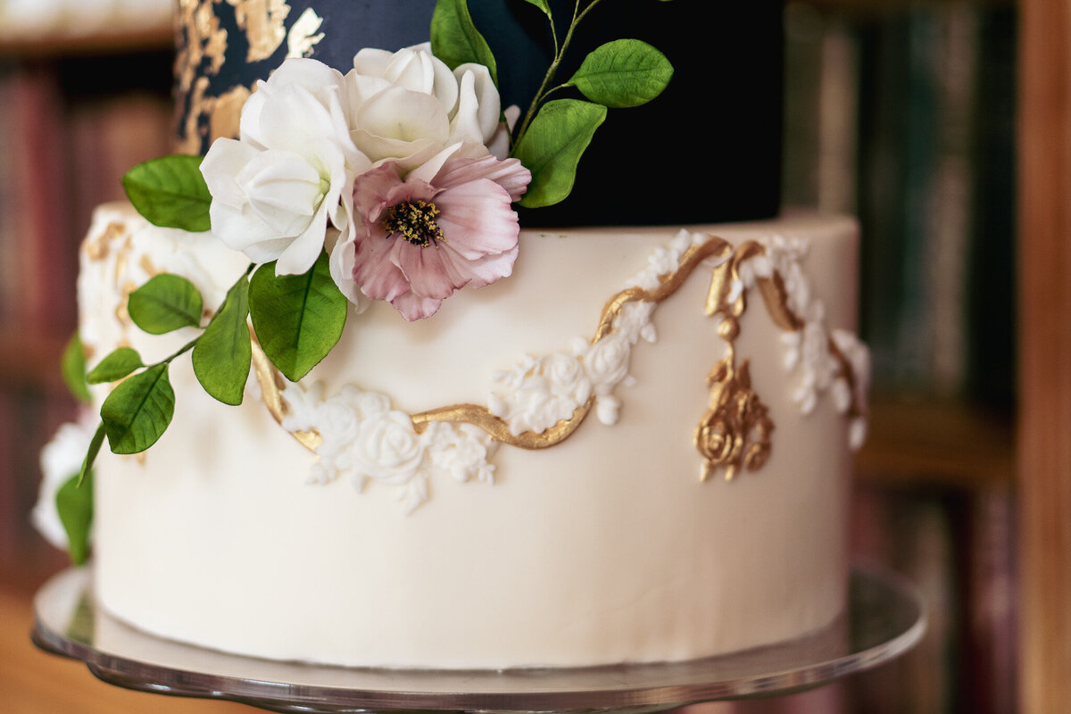 Luxury nature inspired wedding cake designer vanilla Spice Cake Studio Northamptonshire elegant gold white navy sugar flower design