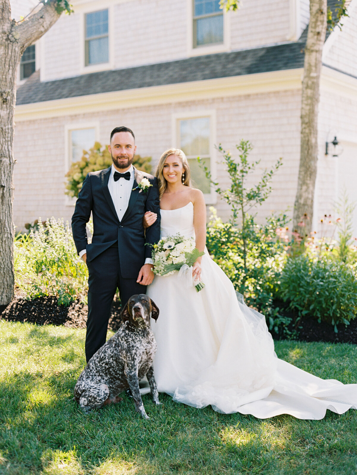 couple portraits with dog at cape cod wedding