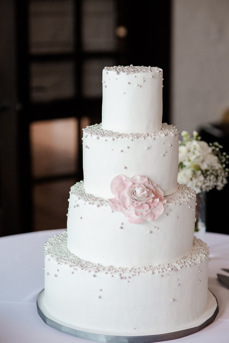 Sparkle wedding cake with floral accent