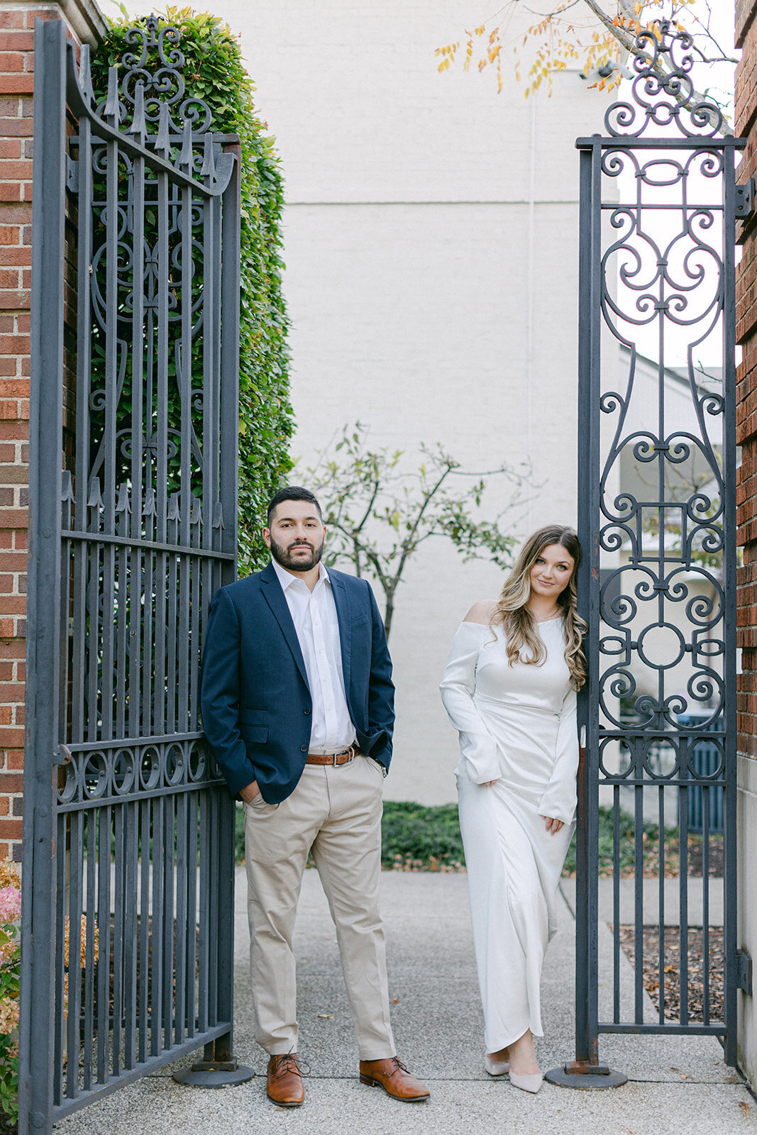 Couple embracing during golden hour engagement session in a Pittsburgh park