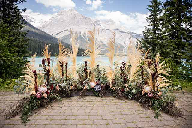 Outdoor ceremony space at Emerald Lake Lodge, rustic and classic Field, British Columbia wedding venue, featured on the Brontë Bride Vendor Guide.