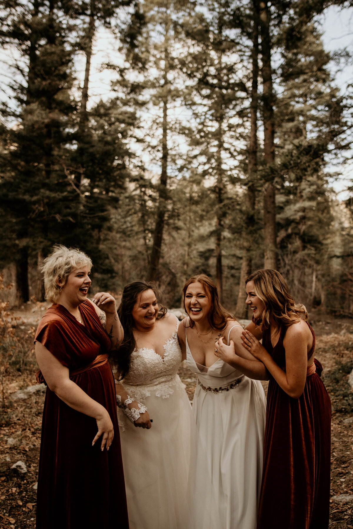 same sex couple bridal part of four laughing