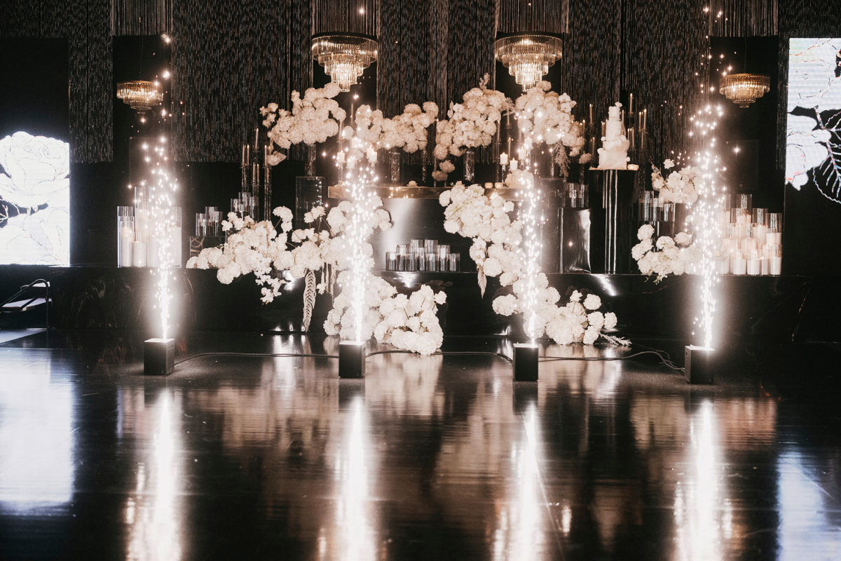 kavita-mohan-black-white-reception-vinyl-dance-floor-sparklers-chandeliers-candles-flowers