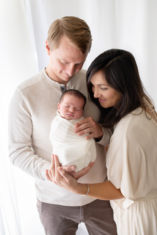 Newborn session of baby with parents