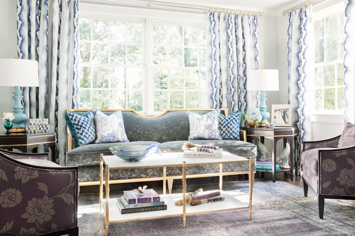 Living Room Interior Design With Gold Accents And Pops Of Blue And Purple