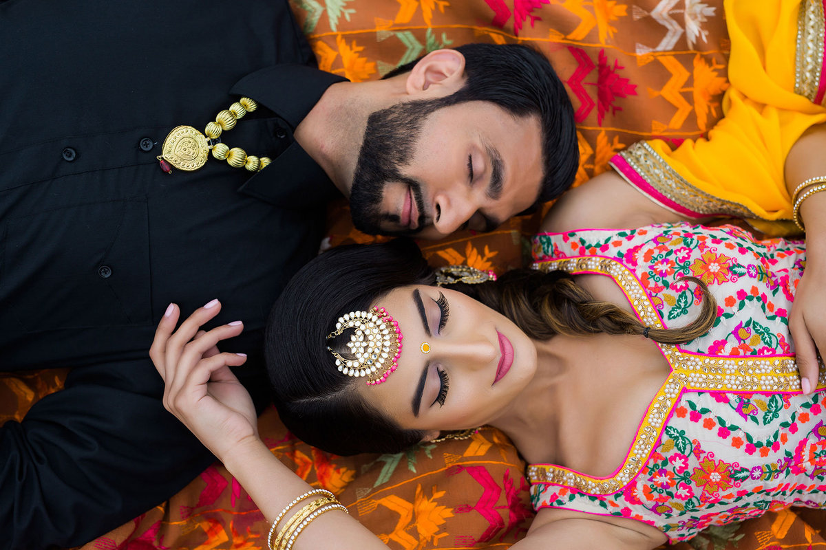 Punjabi couple laying together