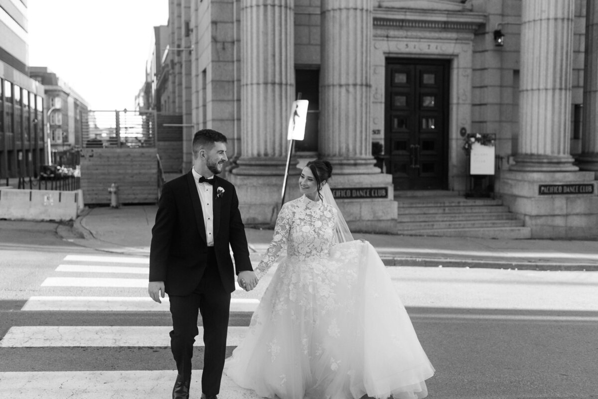 Bride and groom walking along the street in Halifax, Nova Scotia