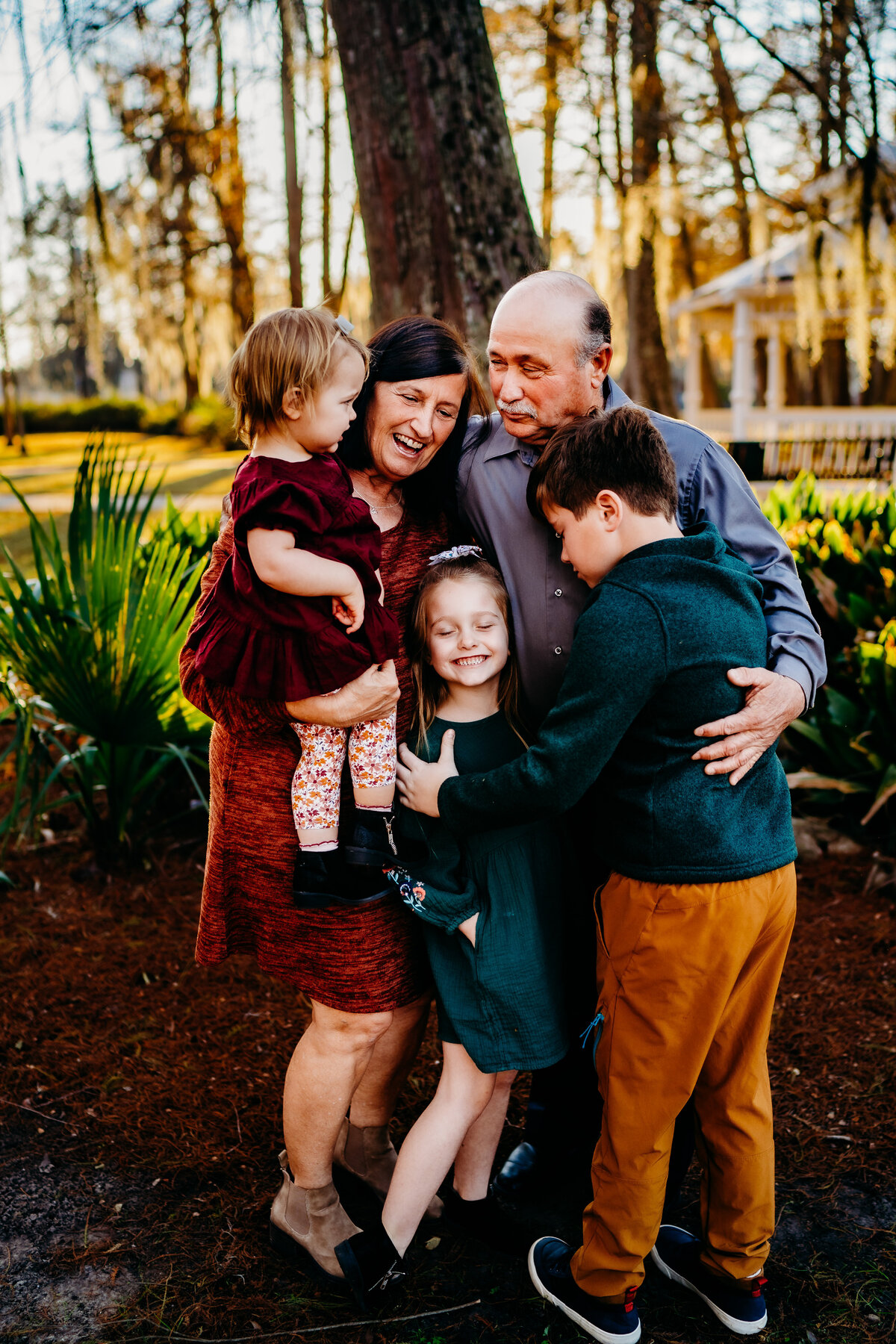 children and grandparents hugging and laughing in Patterson, la