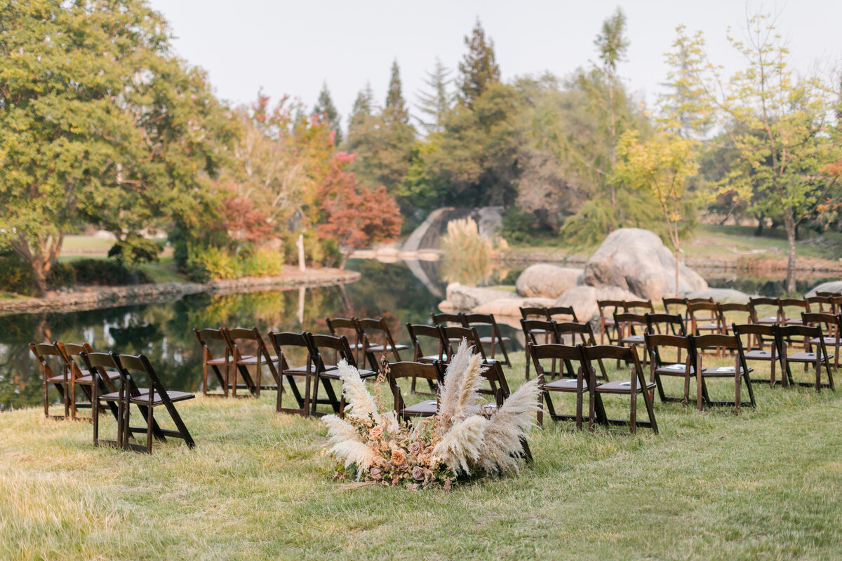 ceremony chairs in front of a lake