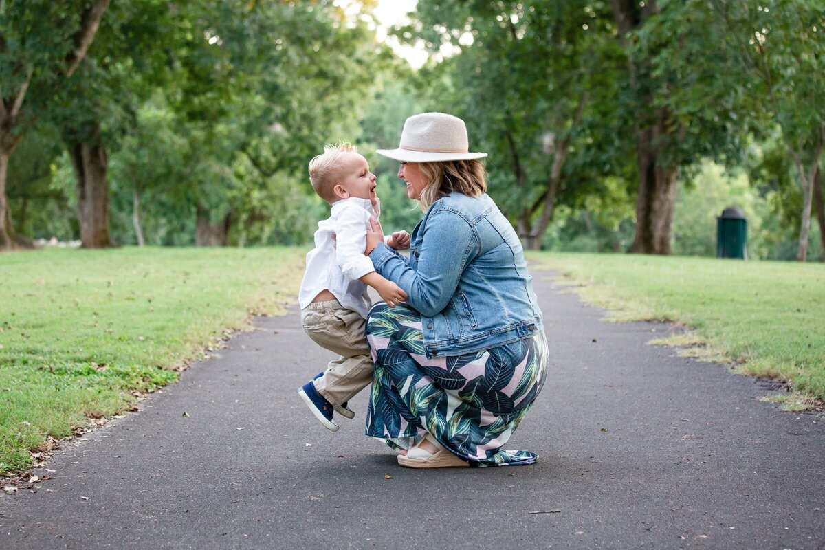 mom holding her toddler son. Spring photo session in Wake Forest, NC.