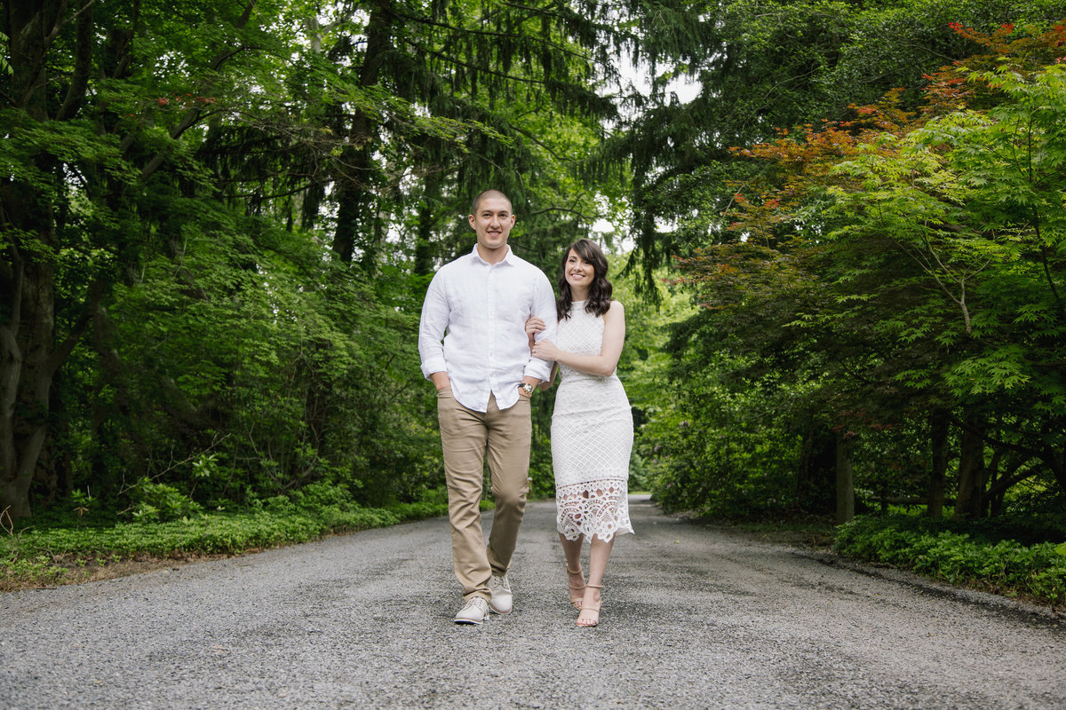 engaged couple walking at sayen gardens