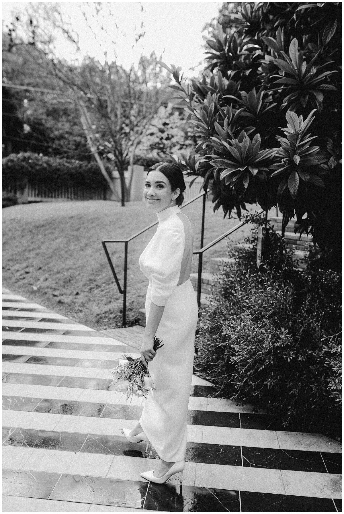 Bride standing on black and white flooring at Hotel Saint Cecilia Austin
