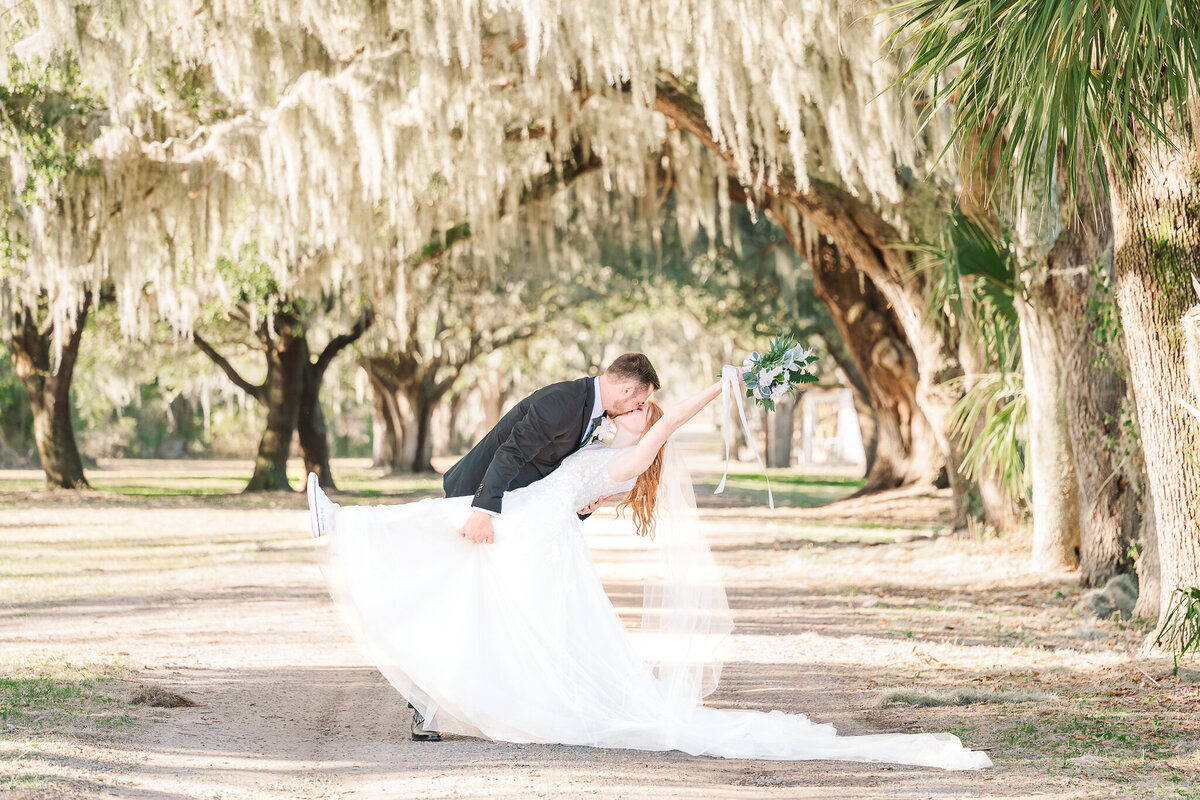 A couple kissing after exchanging their vows in North Carolina by JoLynn Photography