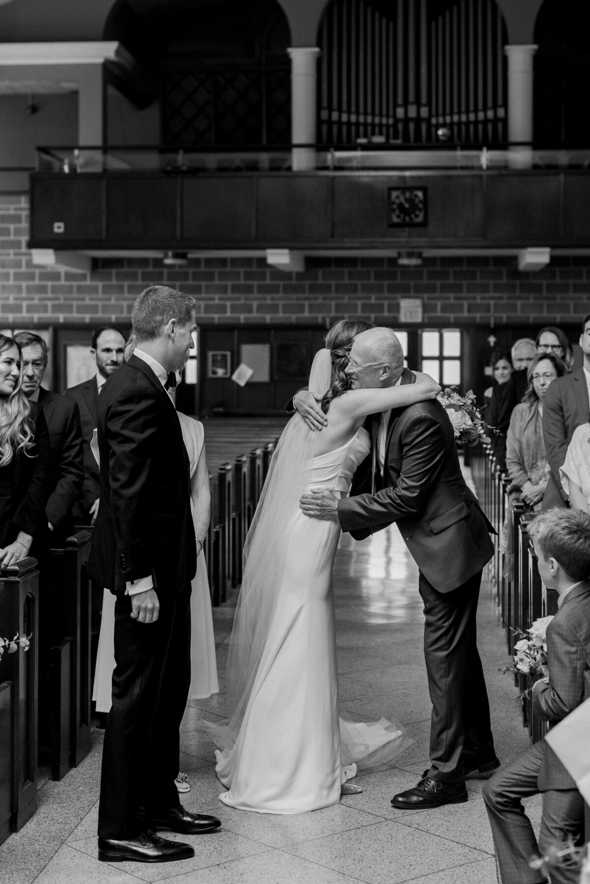 Bride hugging father as he gives her away at Halifax wedding