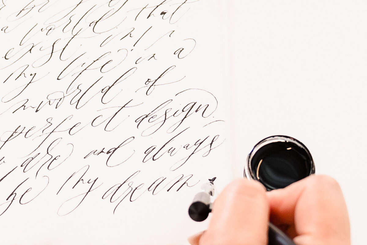 detail shot of a calligrapher's hands
