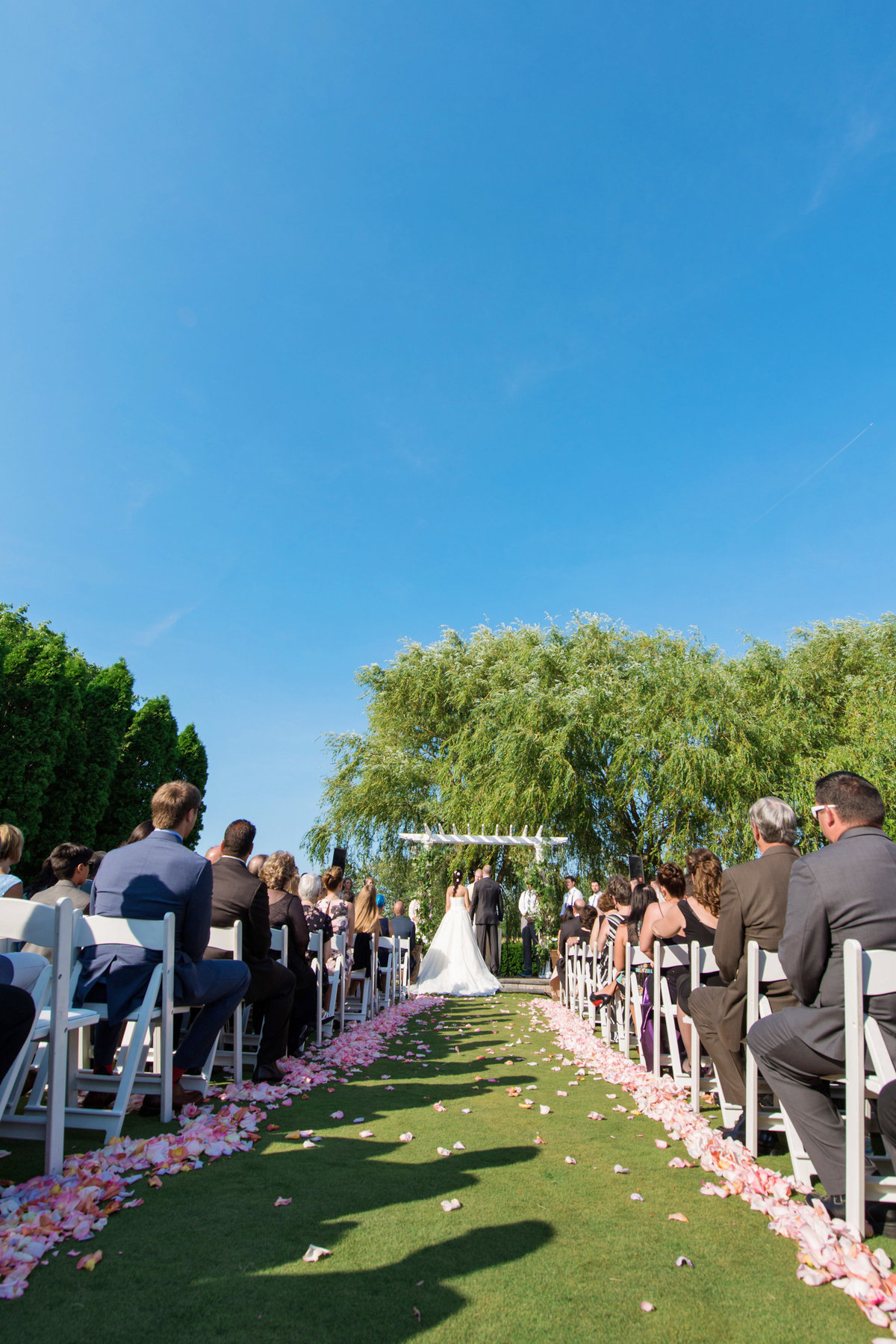 photo of summer outside wedding ceremony at Willow Creek Golf and Country Club