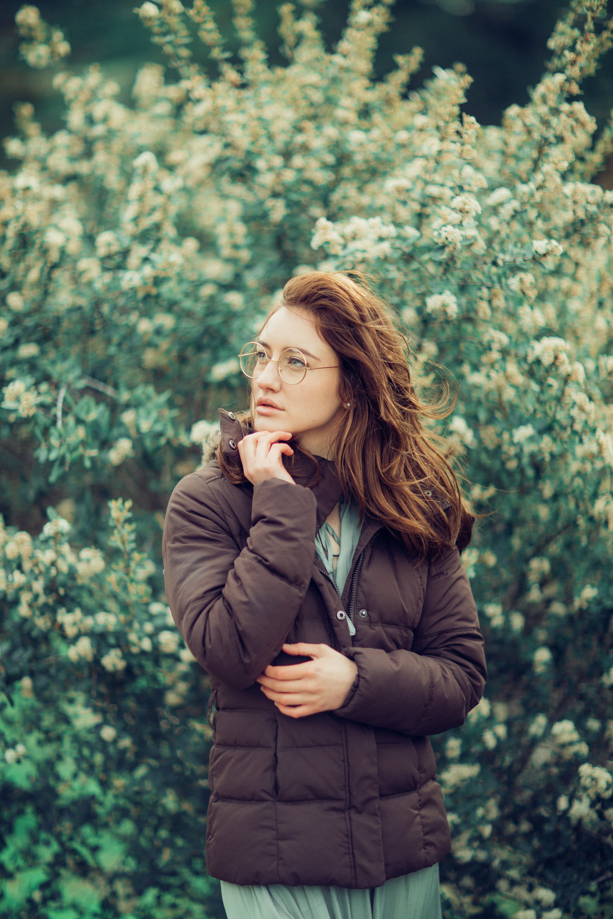 Portrait Photo Of Young Woman In Brown Coat Wearing Eye Glasses Los Angeles