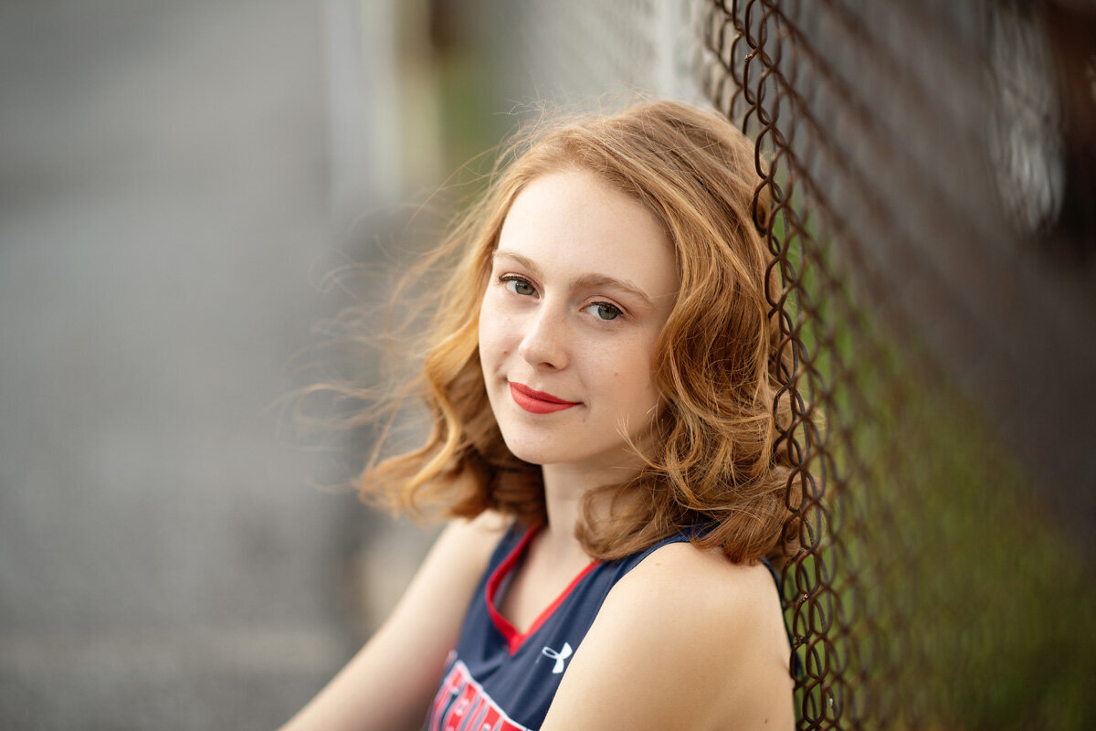 Senior session of young woman wearing a jersey