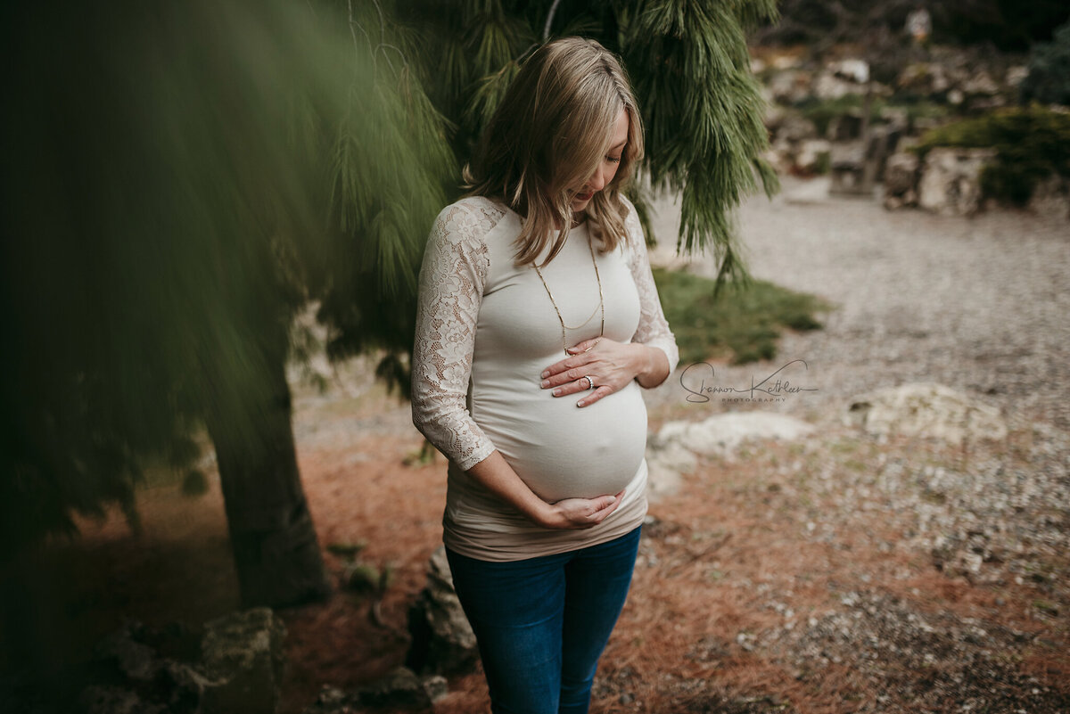 Watch your pregnancy bloom in enchanting garden maternity portraits in the Twin Cities. Shannon Kathleen Photography captures the essence of your blossoming journey.