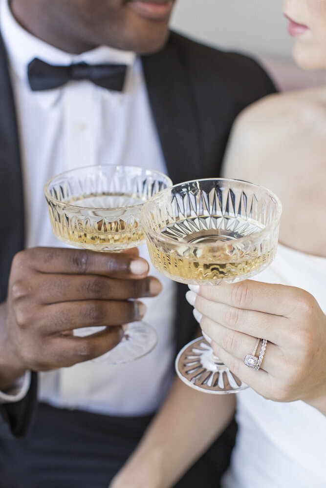 newlyweds toasting with cocktail glasses