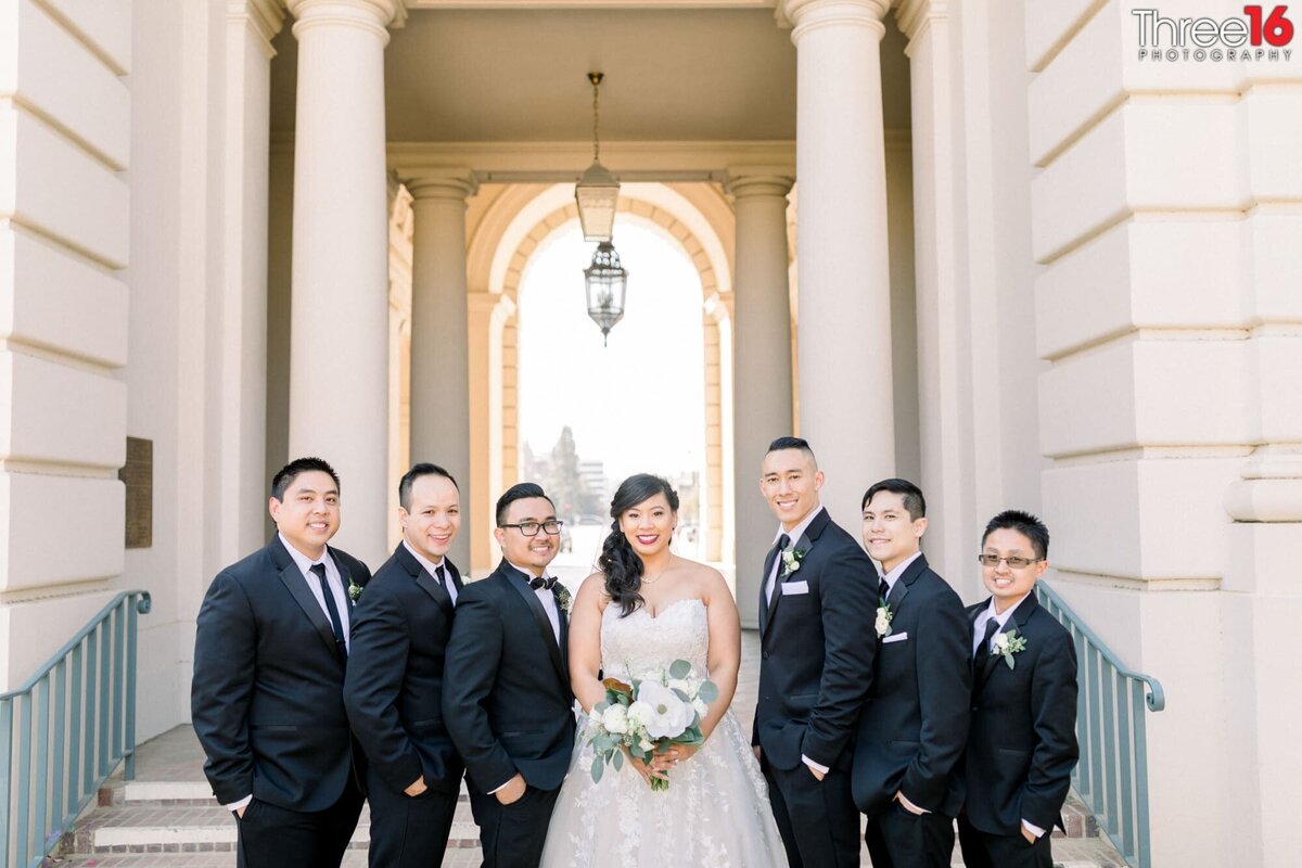 Bride and Groom pose with the groomsmen