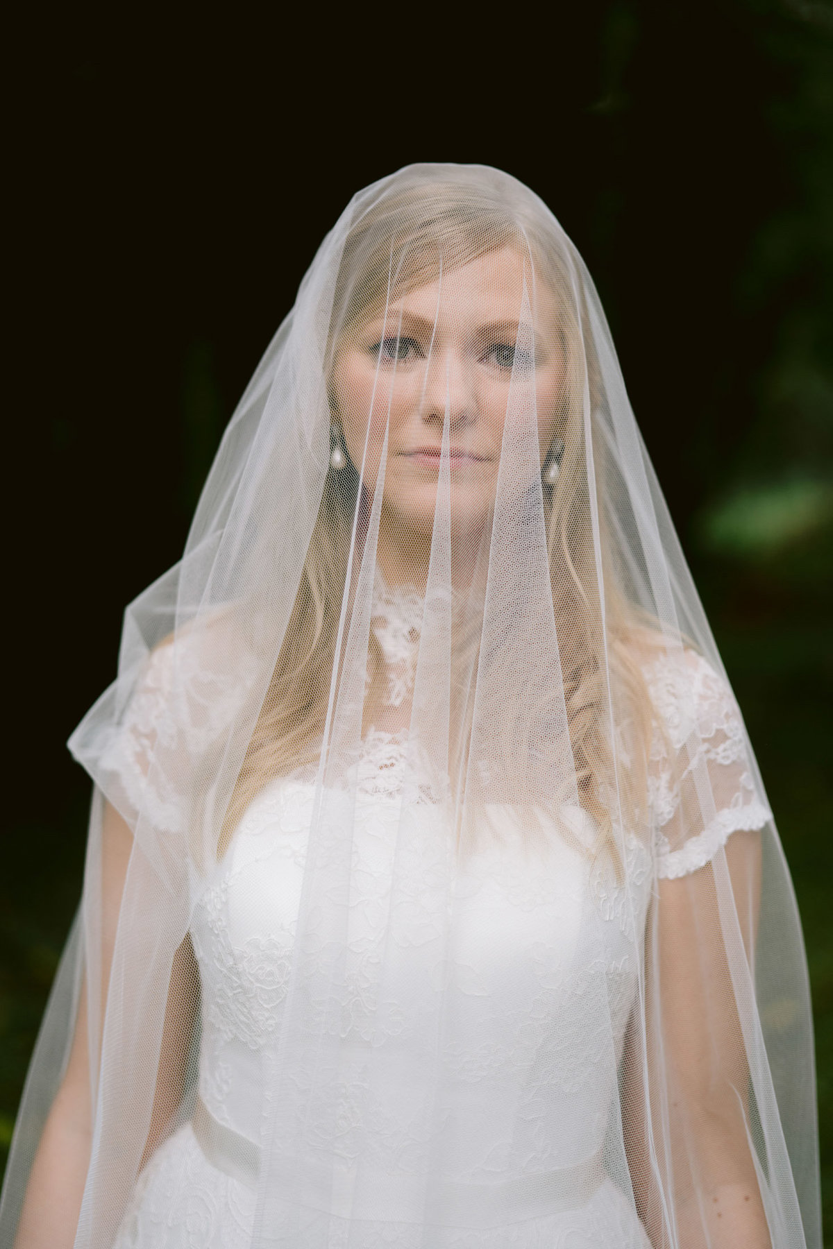 a portrait of the bride weraring her wedding veil