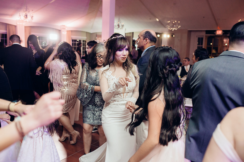Wedding Photograph Of Women In Dresses Dancing With Each Other Los Angeles