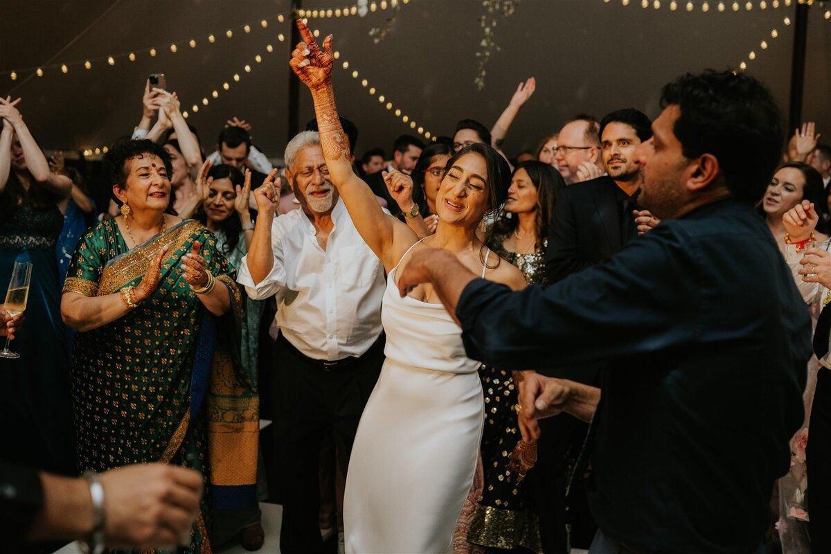 Bride on the dance floor at a tented wedding reception in the Hudson Valley