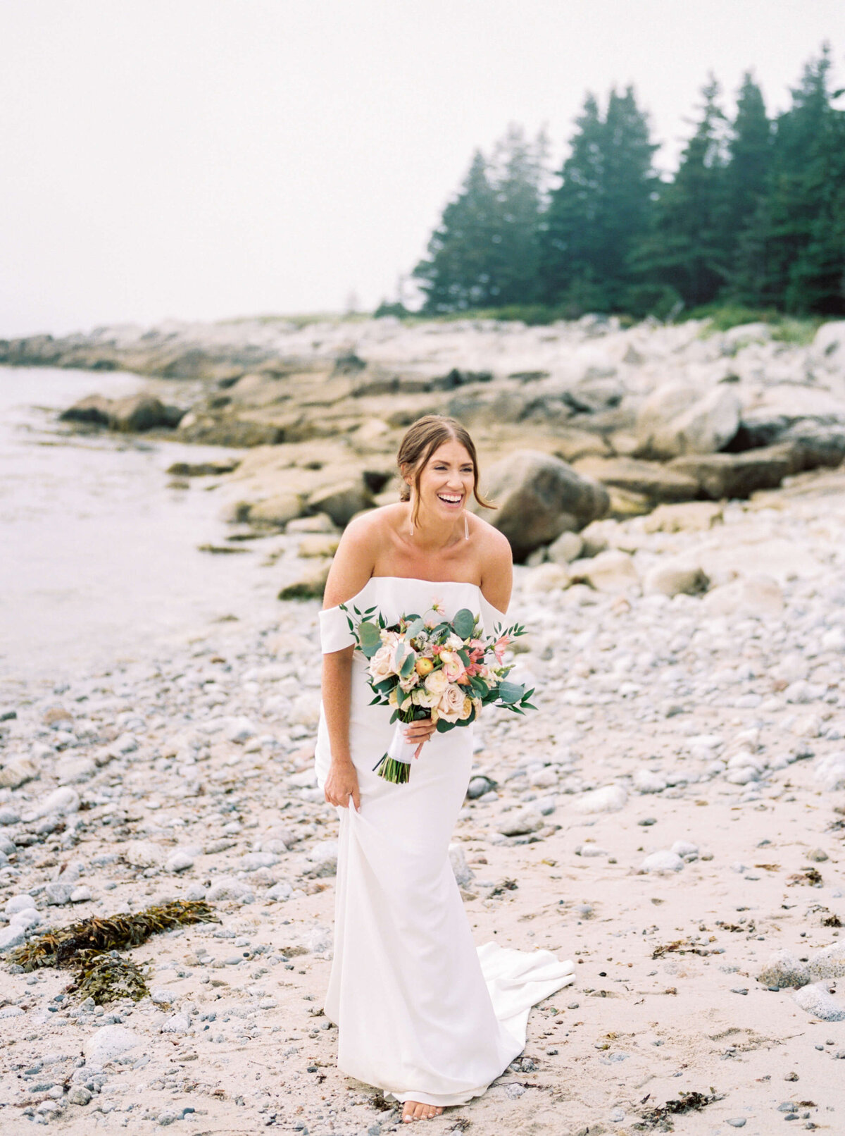 Bride standing on the sand at Oceanstone Resort Wedding in Nova Scotia