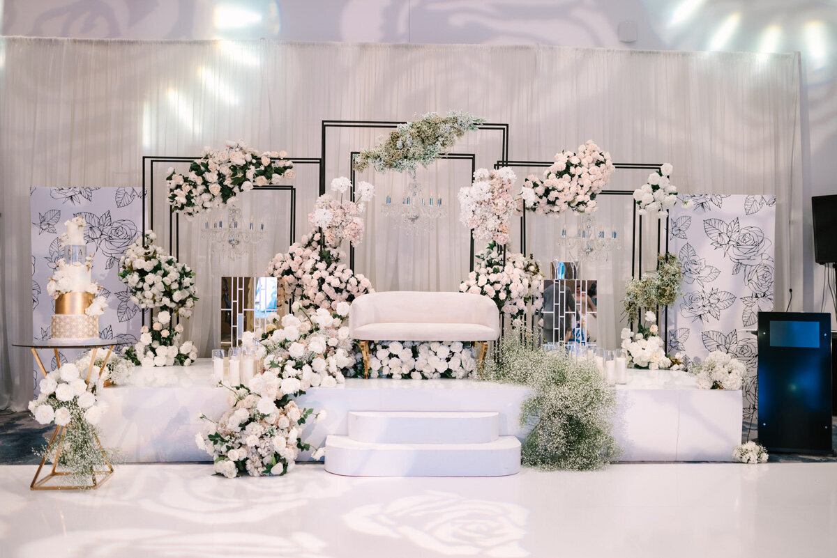 White wedding florals at wedding venue.