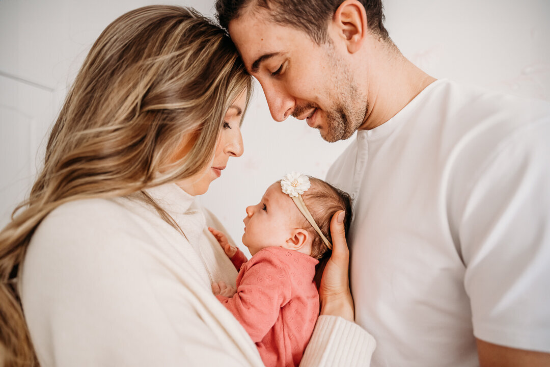 newborn family photographer candid in home